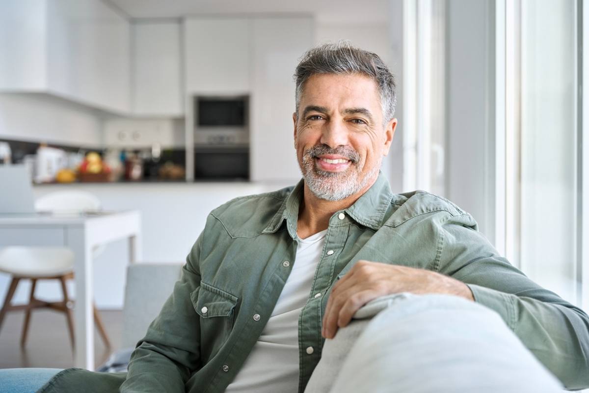 Man at home using telehealth